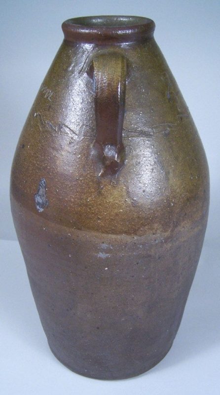 Lot 100: Greene County, Tennessee redware jar attributed to C A Haun