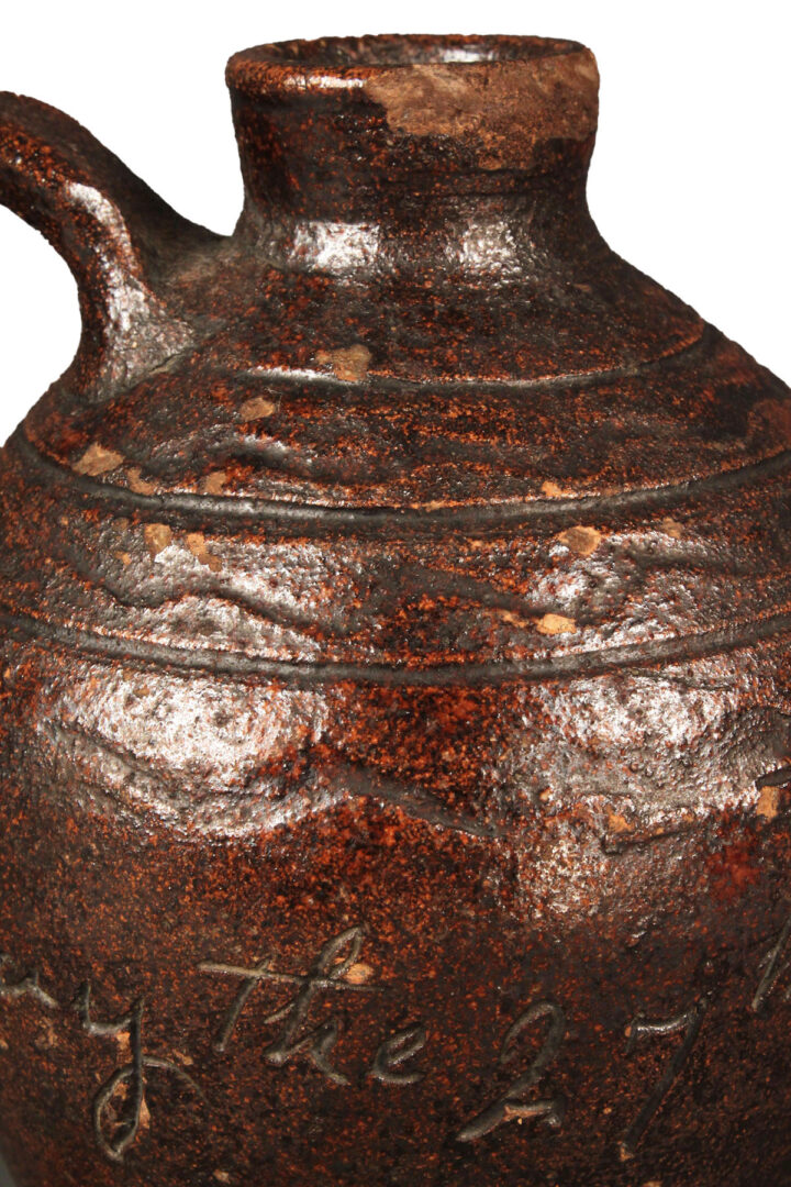 Lot 125: East TN Miniature Redware Jug, G. Mort