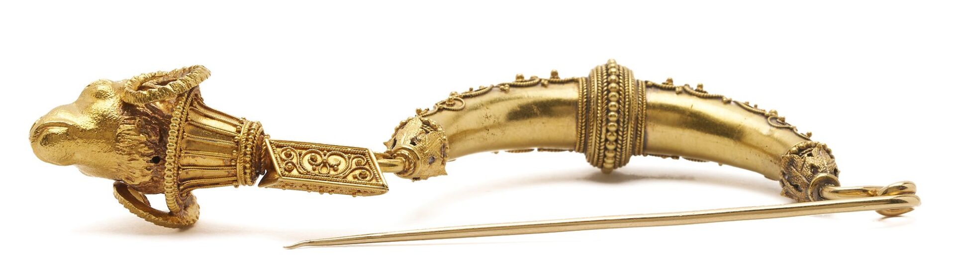 Lot 313: 21K Gold Etruscan Revival Fibula Ram’s Head Brooch circa 1880