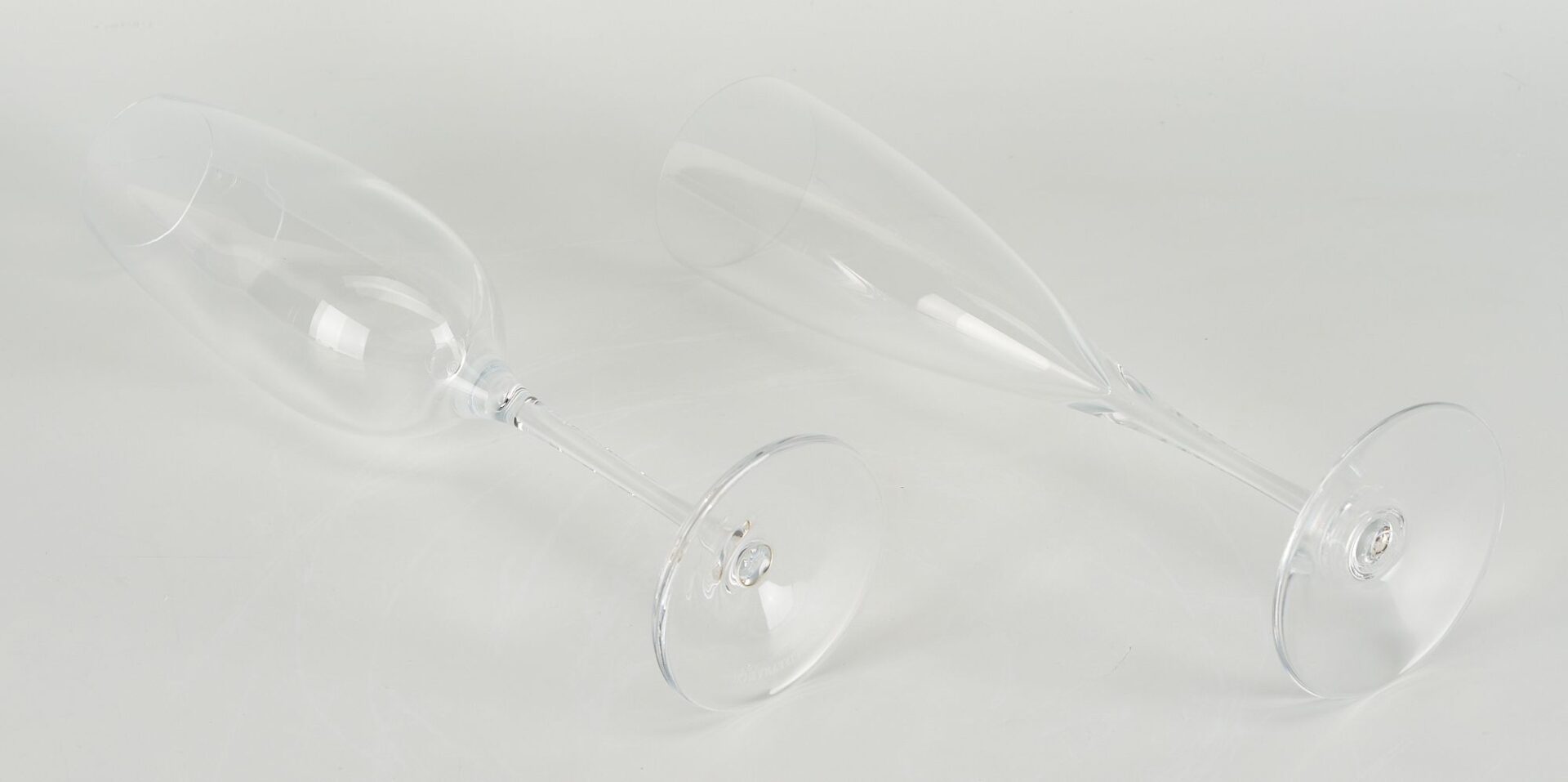 Lot 352: 19 Baccarat Dom Perignon Crystal Glasses & 1 Tiffany Champagne Flute