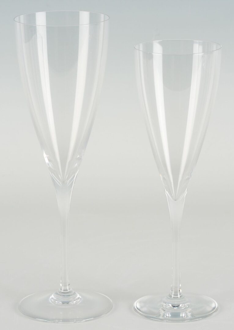 Lot 352: 19 Baccarat Dom Perignon Crystal Glasses & 1 Tiffany Champagne Flute