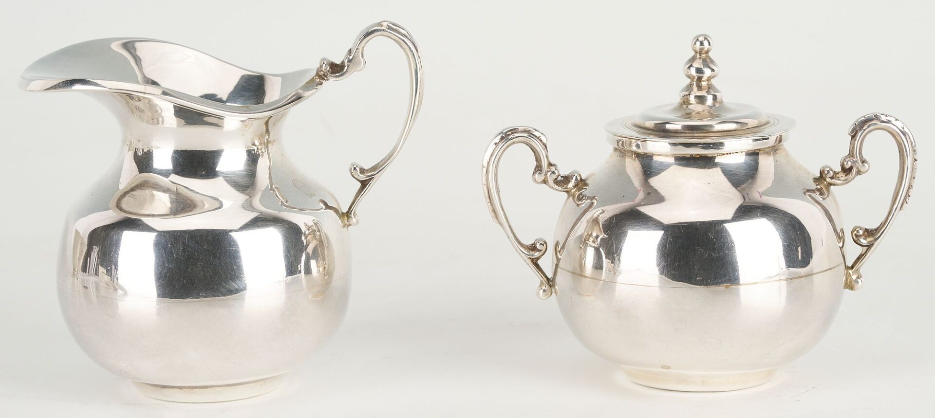 Lot 657: 6 pcs Hollowware incl. Danish Modern Spoons, Mexican Sugar/Creamer Set, Revere Bowl