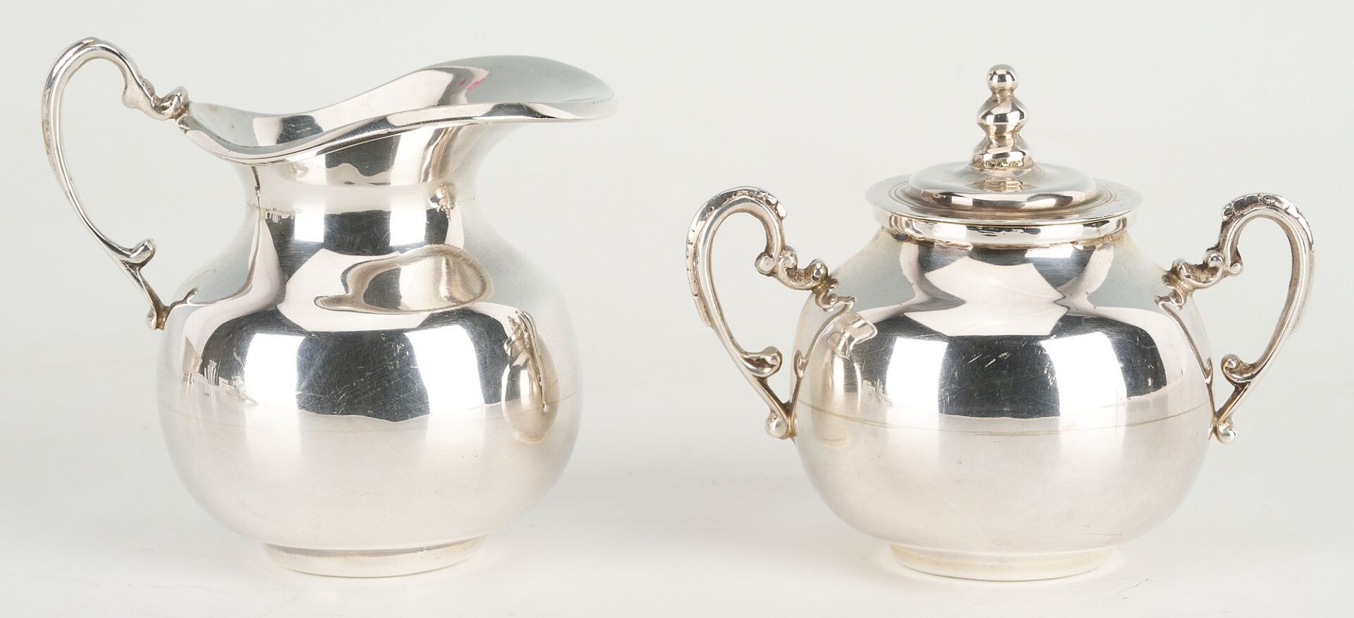 Lot 657: 6 pcs Hollowware incl. Danish Modern Spoons, Mexican Sugar/Creamer Set, Revere Bowl
