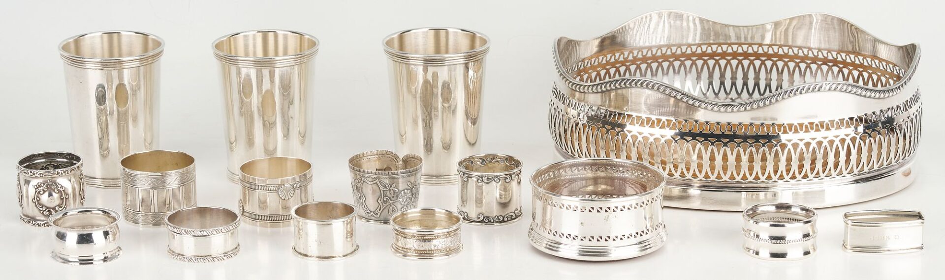 Lot 862: 16 pcs Hollowware including Juleps, Napkin Rings, Wine Coaster