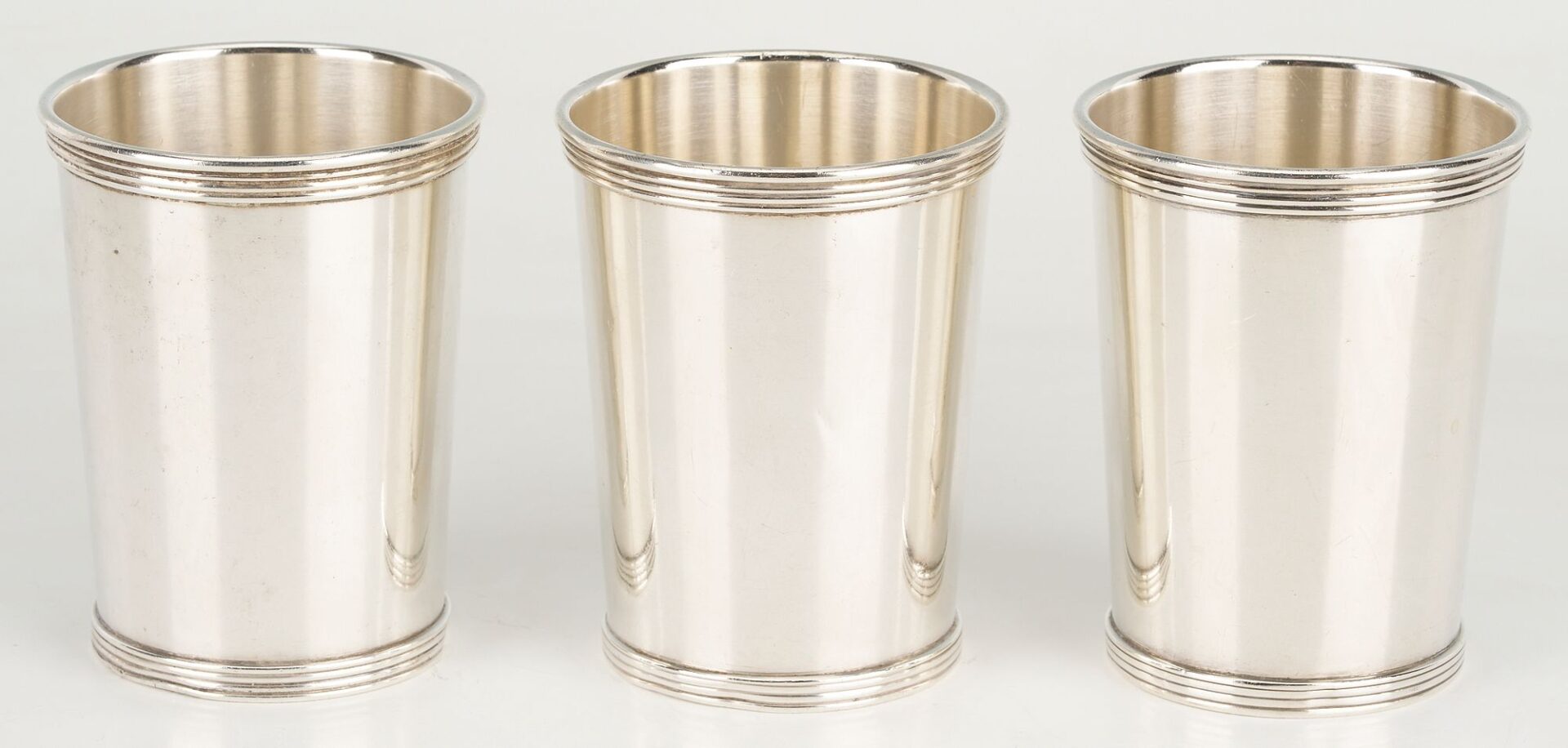 Lot 862: 16 pcs Hollowware including Juleps, Napkin Rings, Wine Coaster