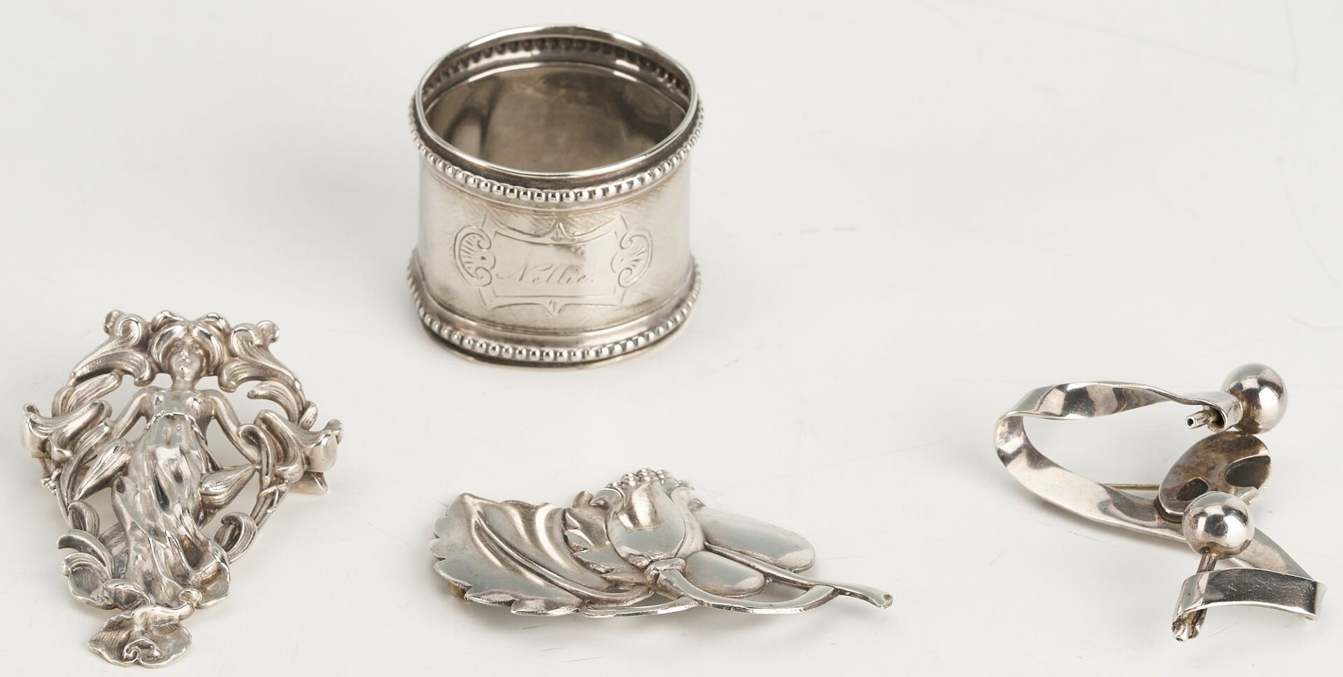 Lot 874: 10 Silver items incl. Tea Caddy, Larding Needles, Cigar Case, Brooches