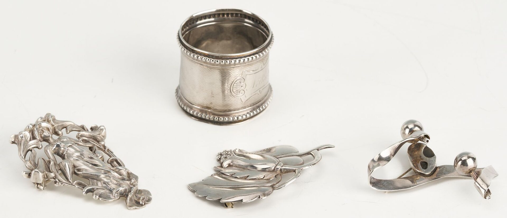 Lot 874: 10 Silver items incl. Tea Caddy, Larding Needles, Cigar Case, Brooches