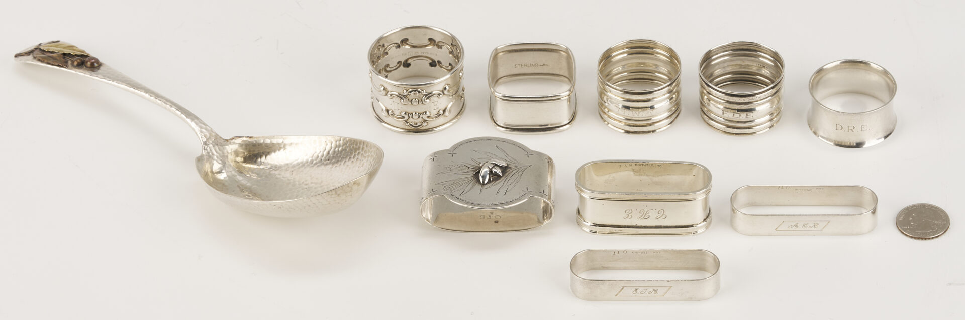 Lot 1202: Gorham Mixed Metal Serving Spoon plus 9 Sterling Napkin Rings