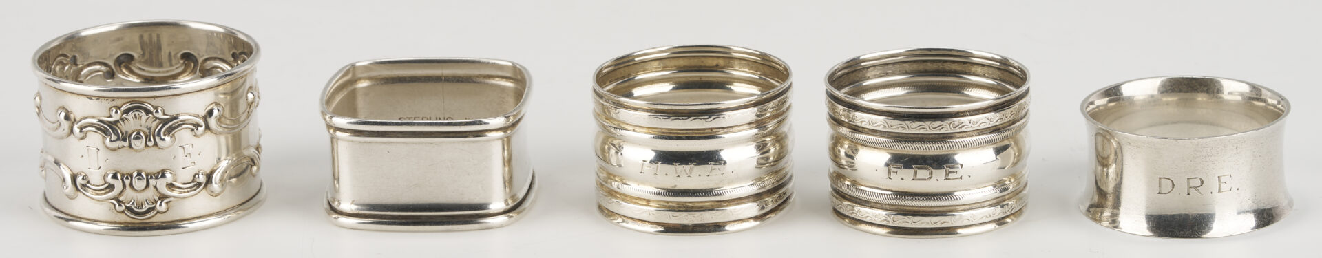 Lot 1202: Gorham Mixed Metal Serving Spoon plus 9 Sterling Napkin Rings