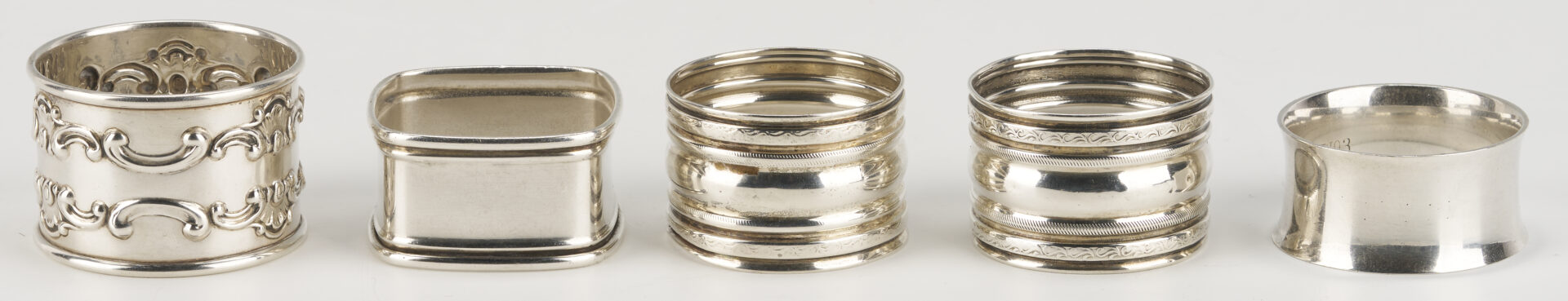 Lot 1202: Gorham Mixed Metal Serving Spoon plus 9 Sterling Napkin Rings