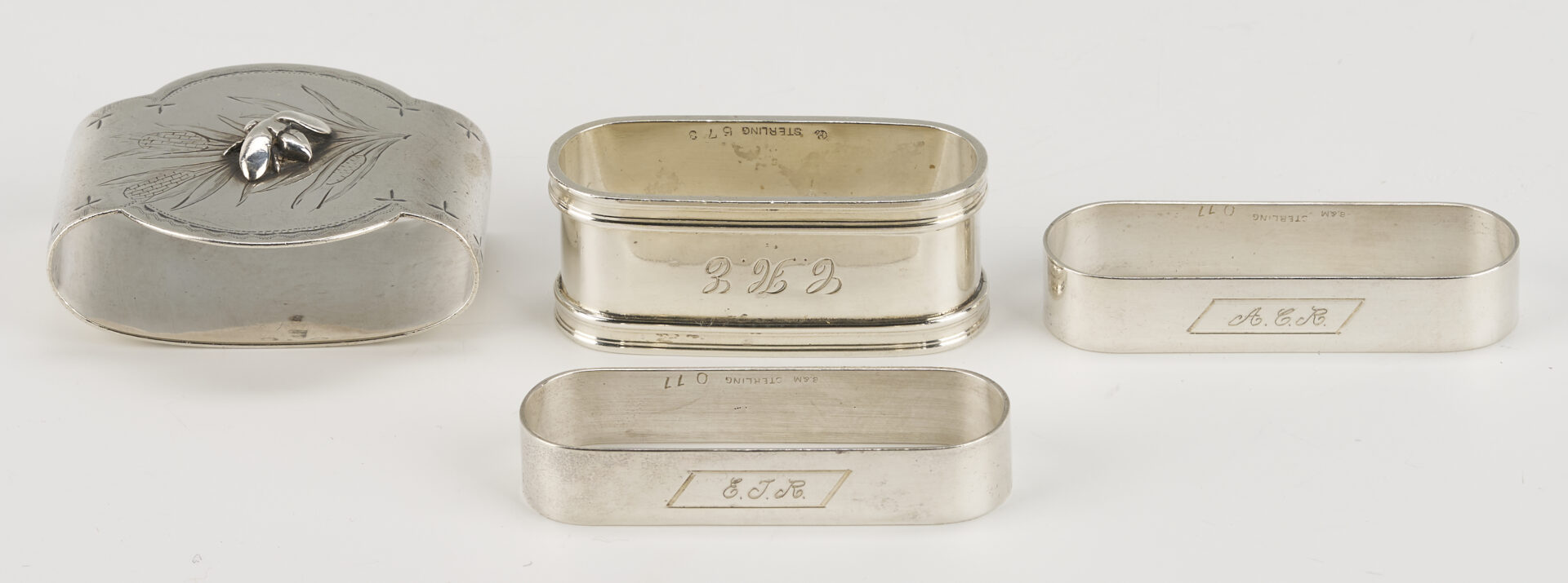 Lot 1202: Gorham Mixed Metal Serving Spoon plus 9 Sterling Napkin Rings