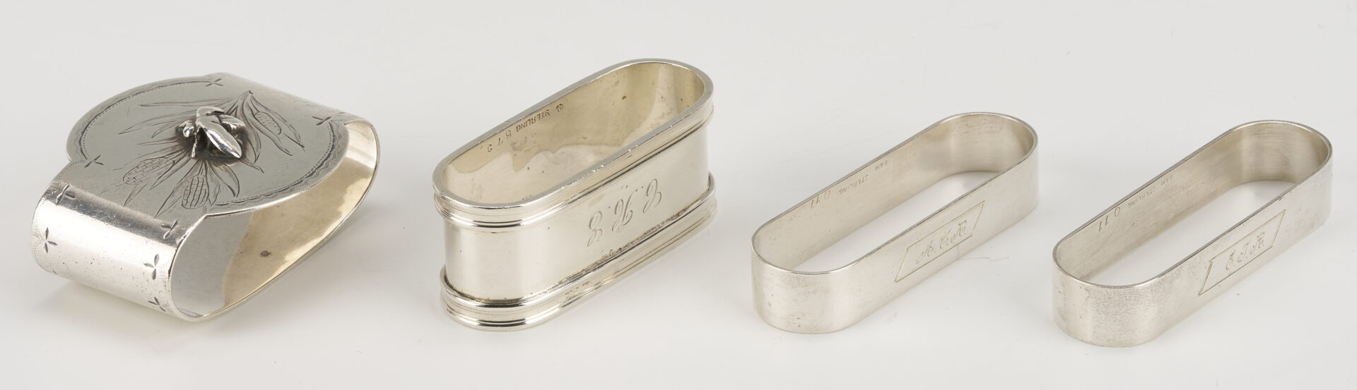 Lot 1202: Gorham Mixed Metal Serving Spoon plus 9 Sterling Napkin Rings