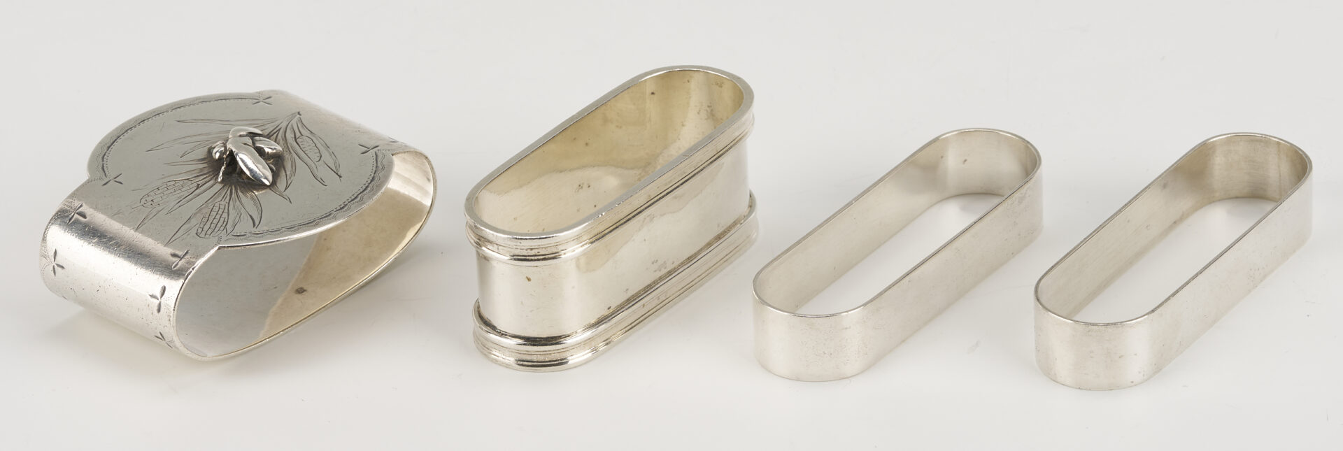 Lot 1202: Gorham Mixed Metal Serving Spoon plus 9 Sterling Napkin Rings