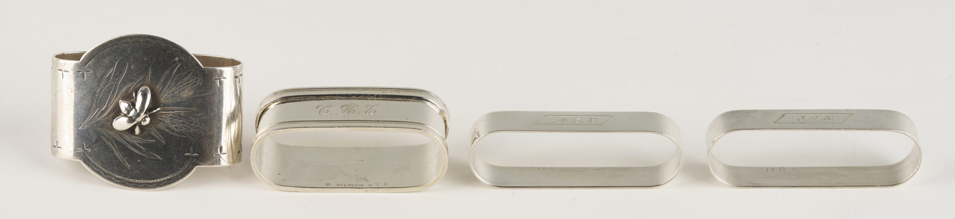 Lot 1202: Gorham Mixed Metal Serving Spoon plus 9 Sterling Napkin Rings