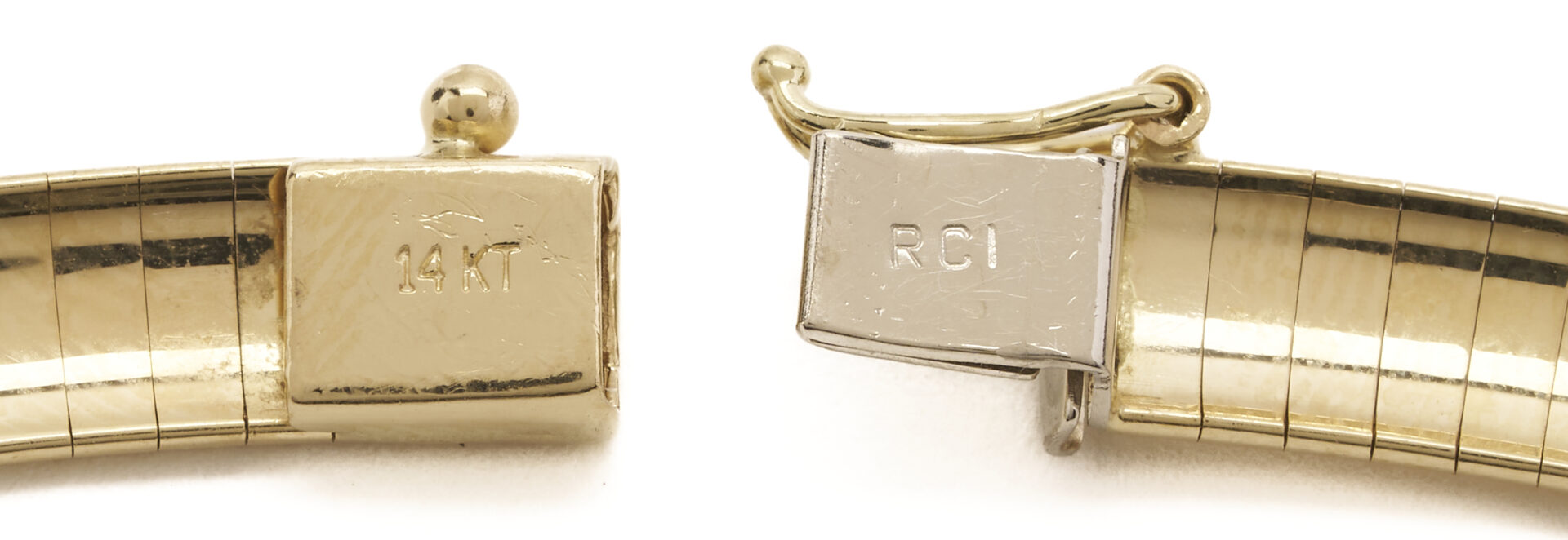 Lot 335: 14K Domed Omega Necklace w/ 10K Chanel Set Baguette Slide
