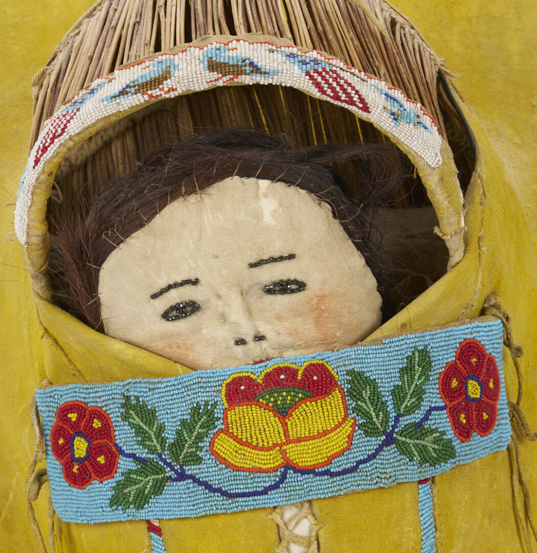 Lot 492: Large Ute Beaded Hide Doll Cradle Board