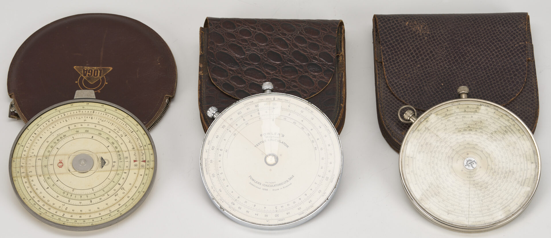Lot 578: Collection of 9 Circular Slide Rules / Calculators Incl. Fowler