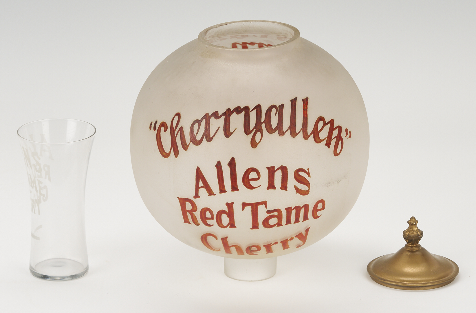 Lot 581: Allens Red Tame Cherry Syrup Soda Fountain Dispenser and Glass