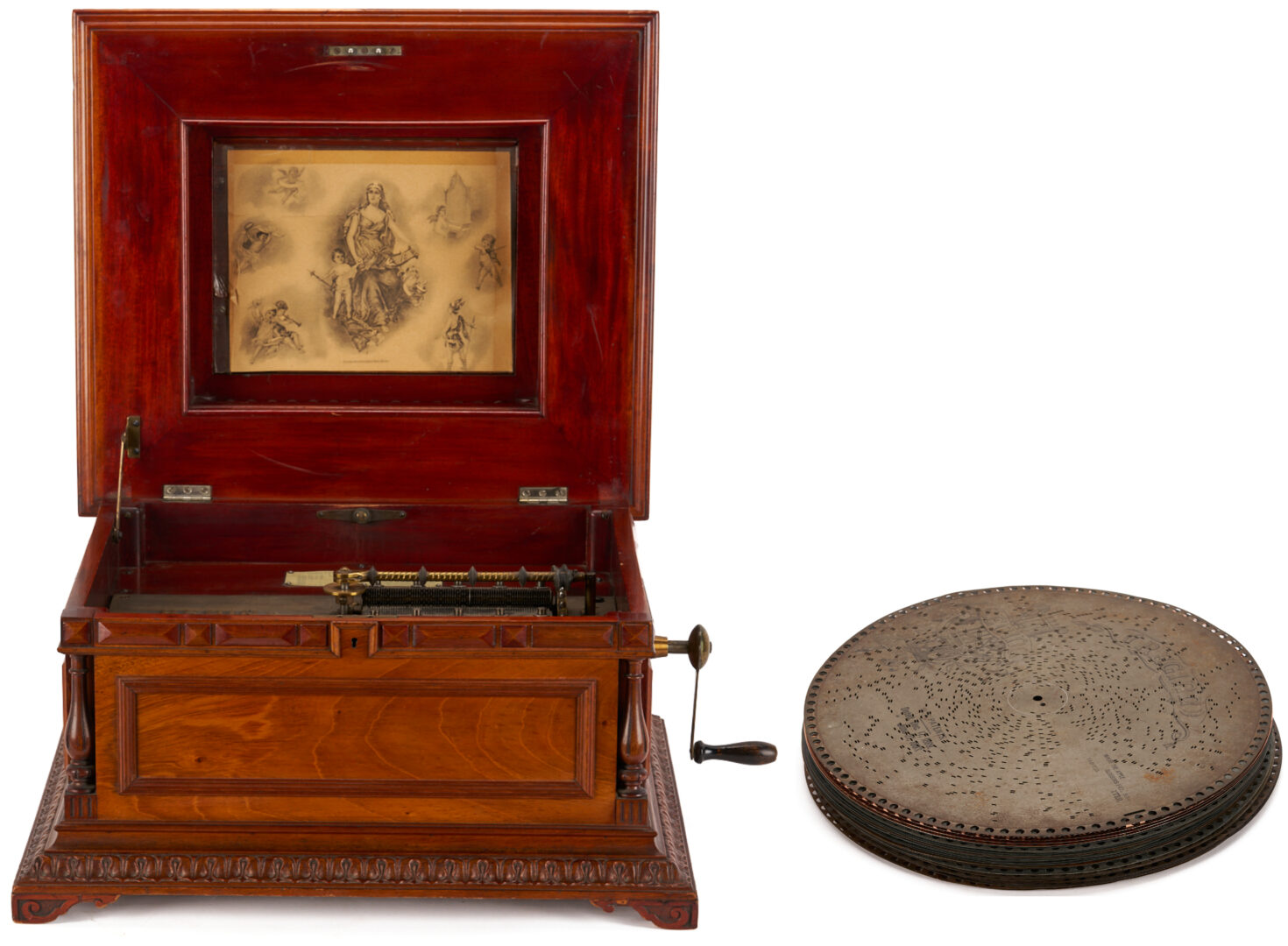 Lot 590: Regina Music Box Style 10, Pagoda Top, plus 26 discs and book