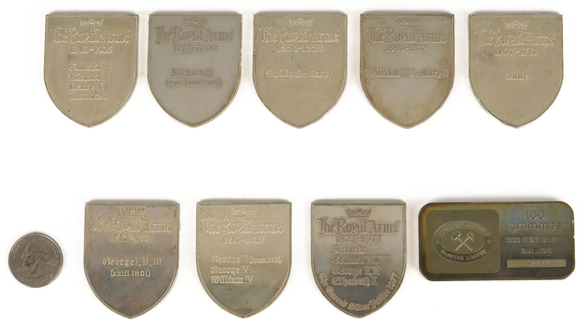 Lot 615: 9 English Silver Ingots, incl. Shield Form