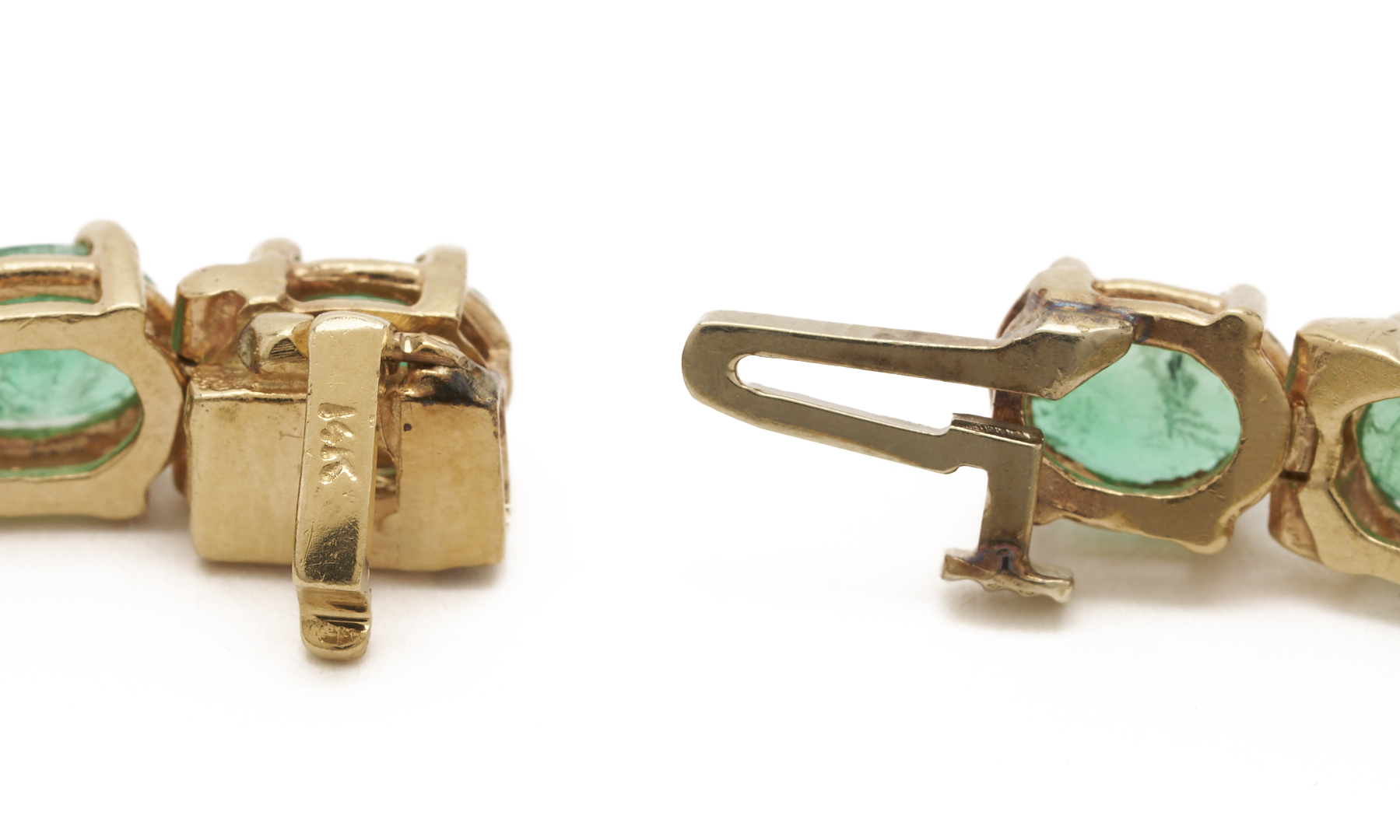 Lot 659: Ladies 14K Emerald Tennis Bracelet