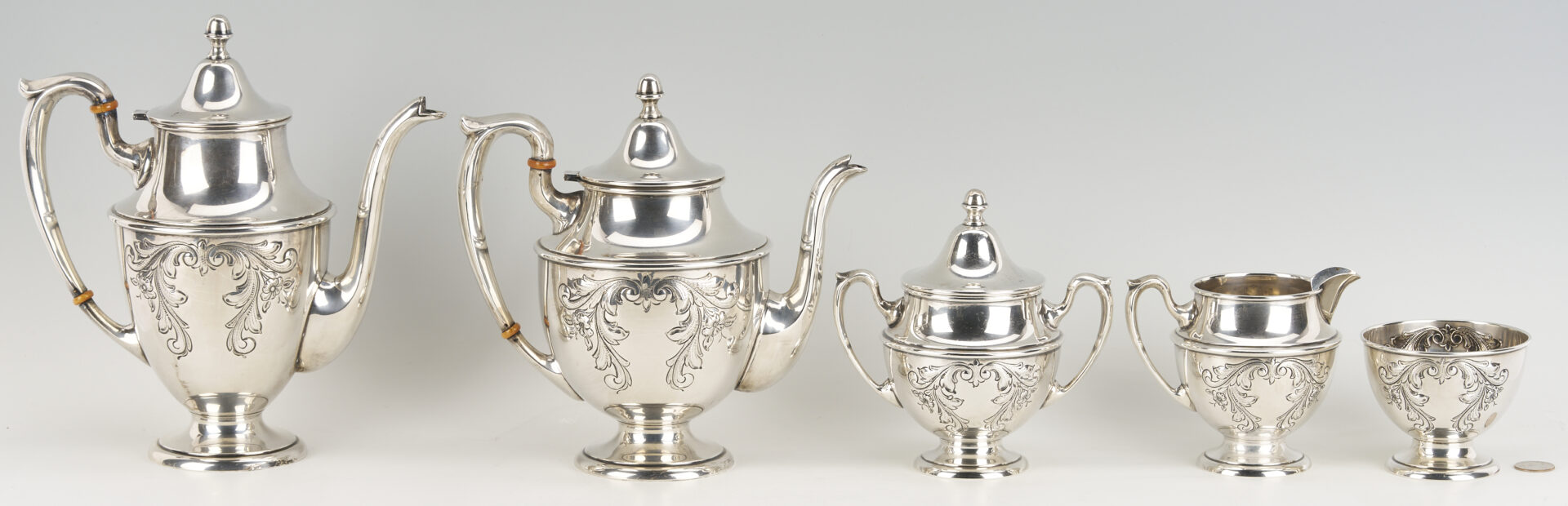 Lot 686: Dunkirk Hand Chased 5 pc. Sterling Silver Tea Set