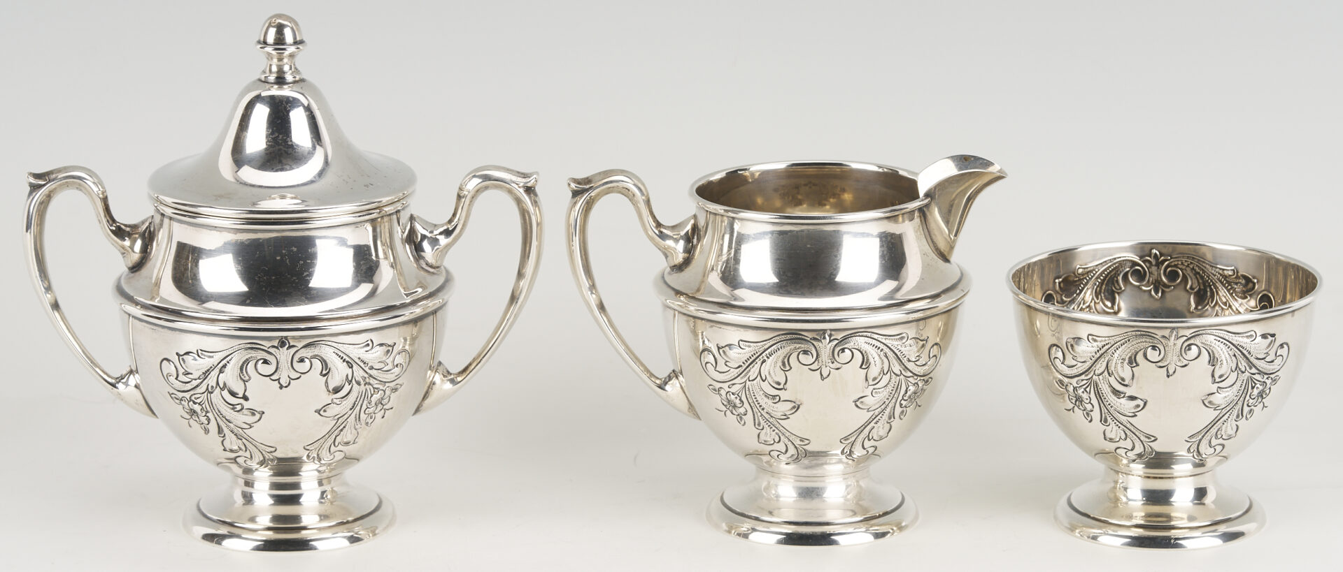 Lot 686: Dunkirk Hand Chased 5 pc. Sterling Silver Tea Set