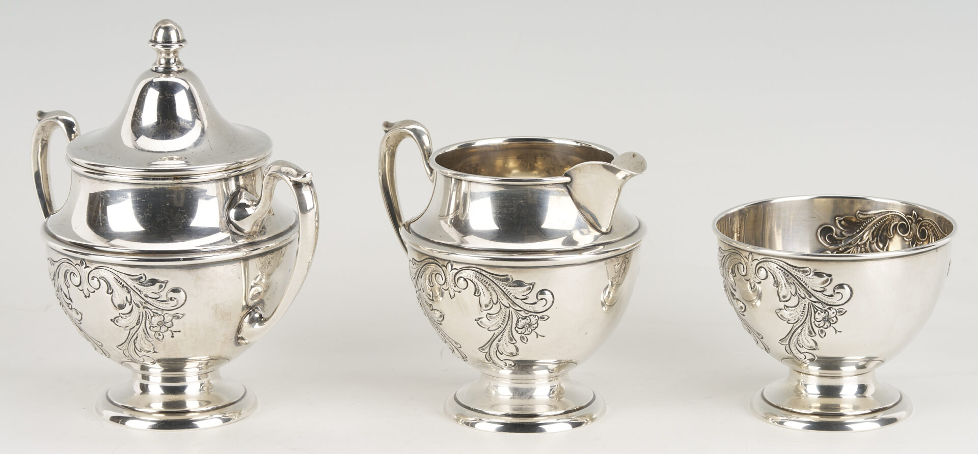 Lot 686: Dunkirk Hand Chased 5 pc. Sterling Silver Tea Set
