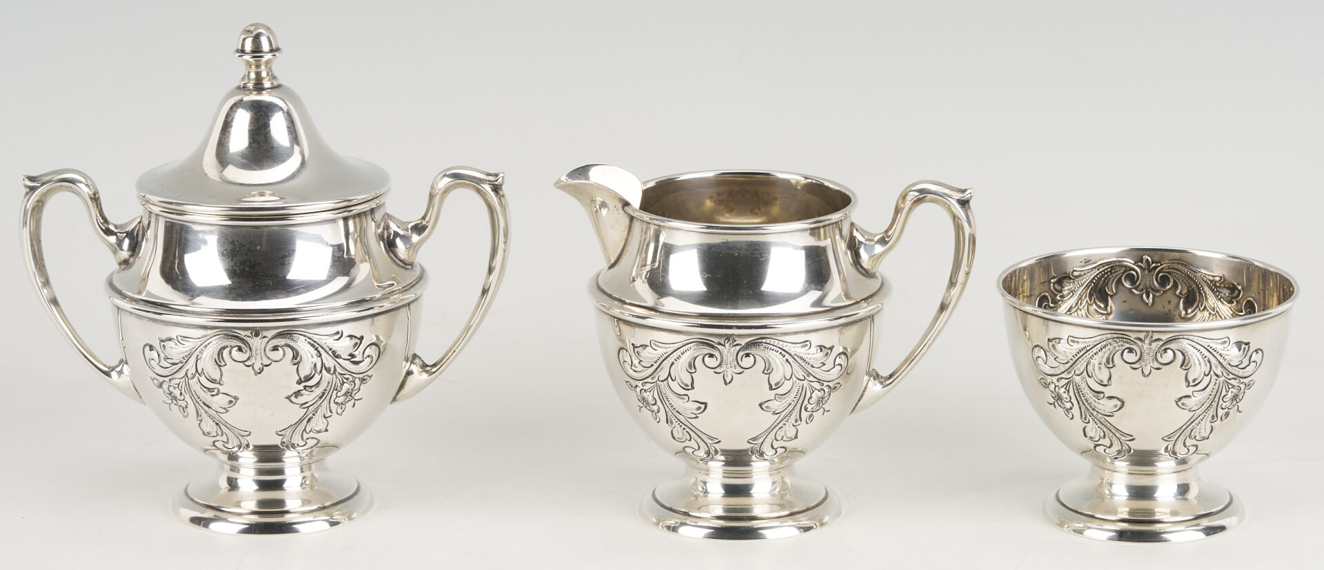 Lot 686: Dunkirk Hand Chased 5 pc. Sterling Silver Tea Set
