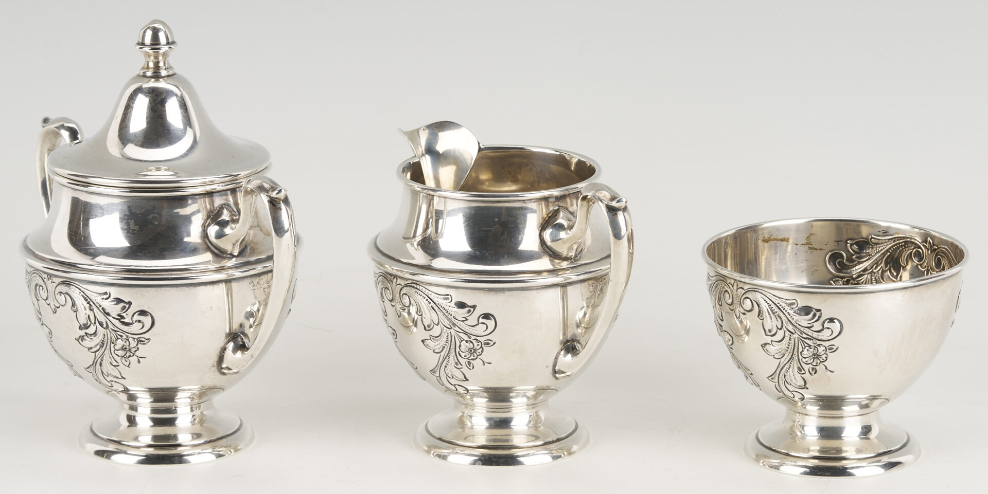 Lot 686: Dunkirk Hand Chased 5 pc. Sterling Silver Tea Set