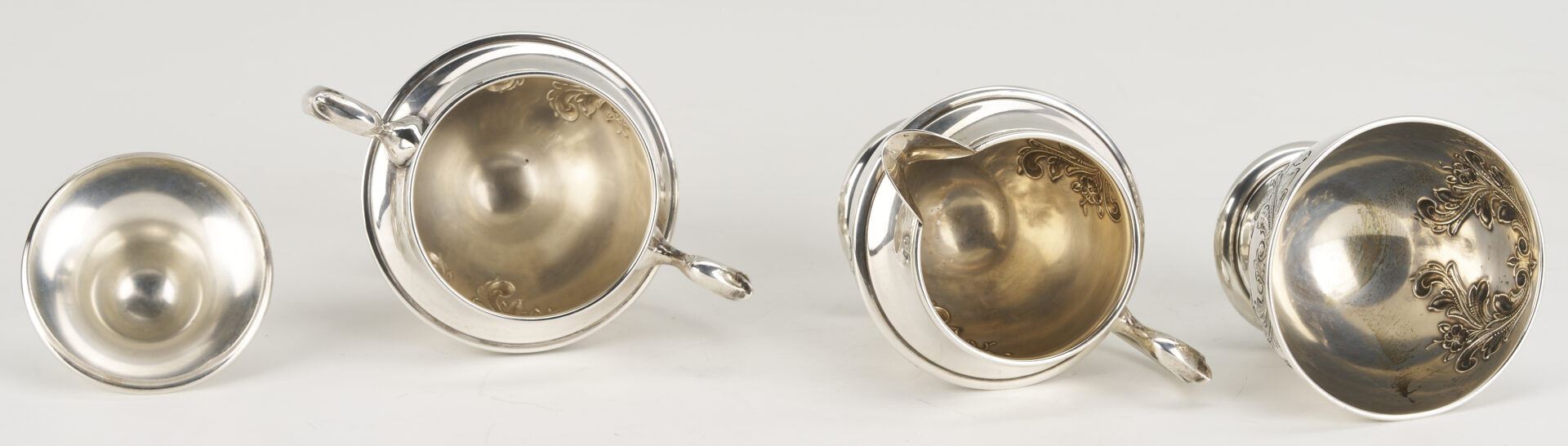Lot 686: Dunkirk Hand Chased 5 pc. Sterling Silver Tea Set