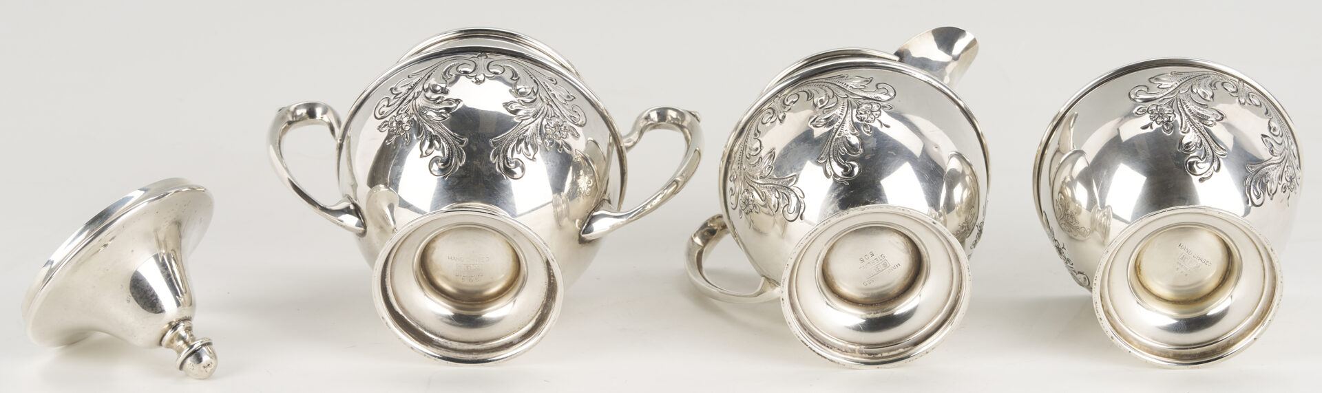 Lot 686: Dunkirk Hand Chased 5 pc. Sterling Silver Tea Set