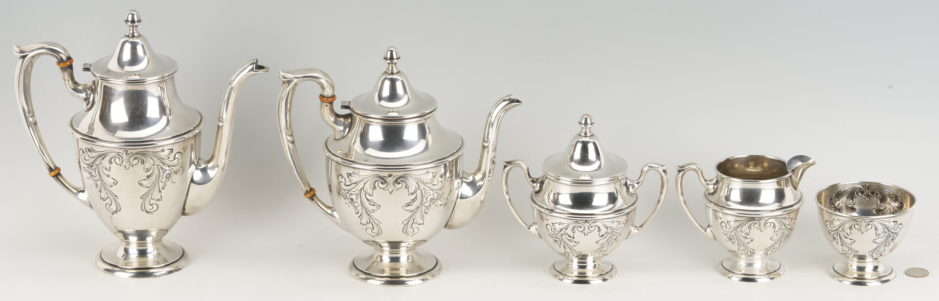 Lot 686: Dunkirk Hand Chased 5 pc. Sterling Silver Tea Set