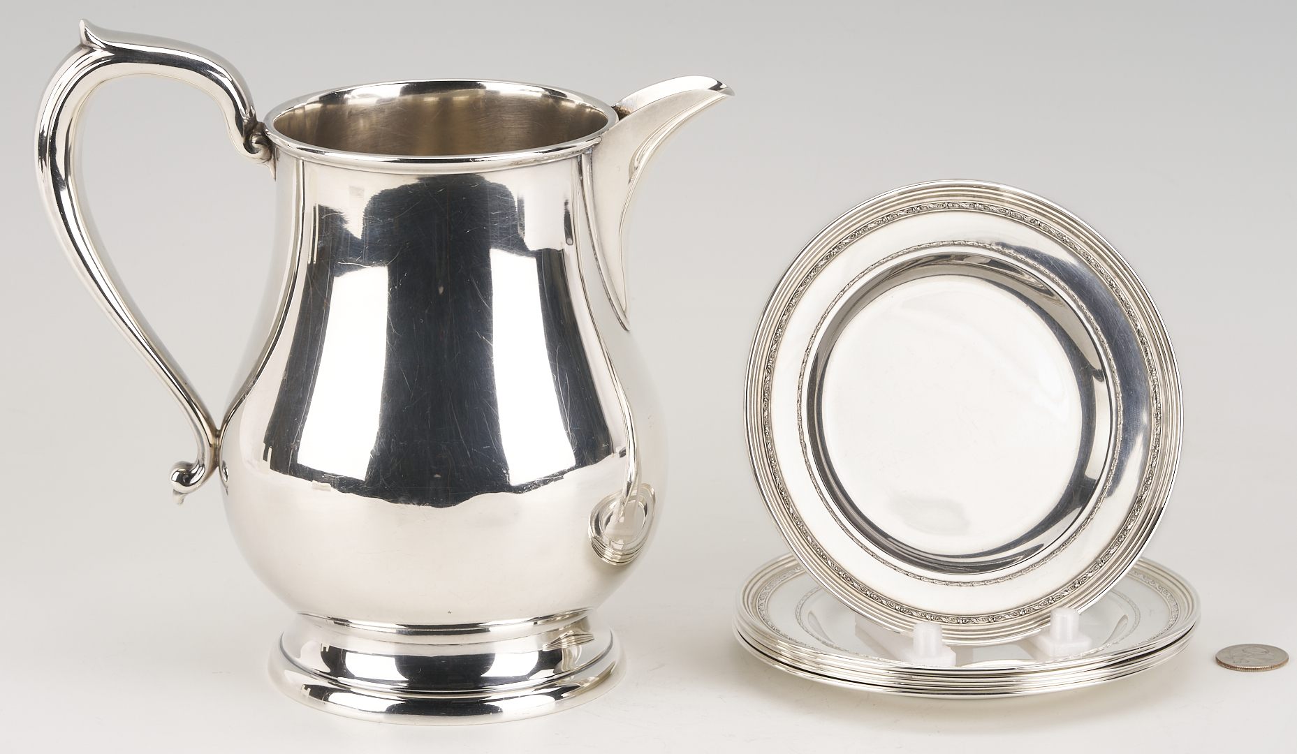 Lot 706: Kirk Sterling Pitcher plus 6 International Sterling Bread Plates