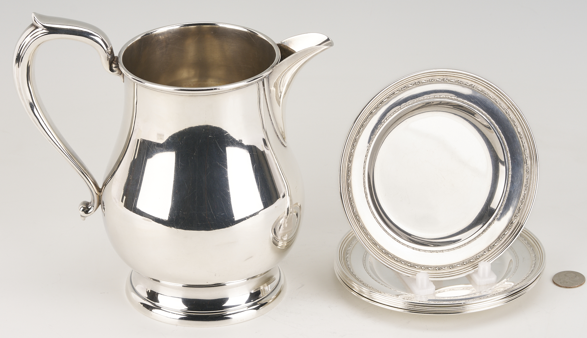 Lot 706: Kirk Sterling Pitcher plus 6 International Sterling Bread Plates
