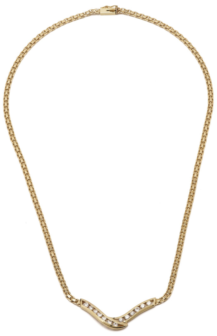 Lot 803: 14K Channel Set Diamond V Necklace