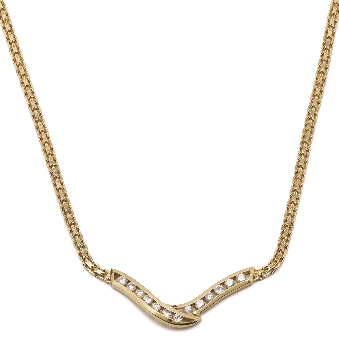 Lot 803: 14K Channel Set Diamond V Necklace