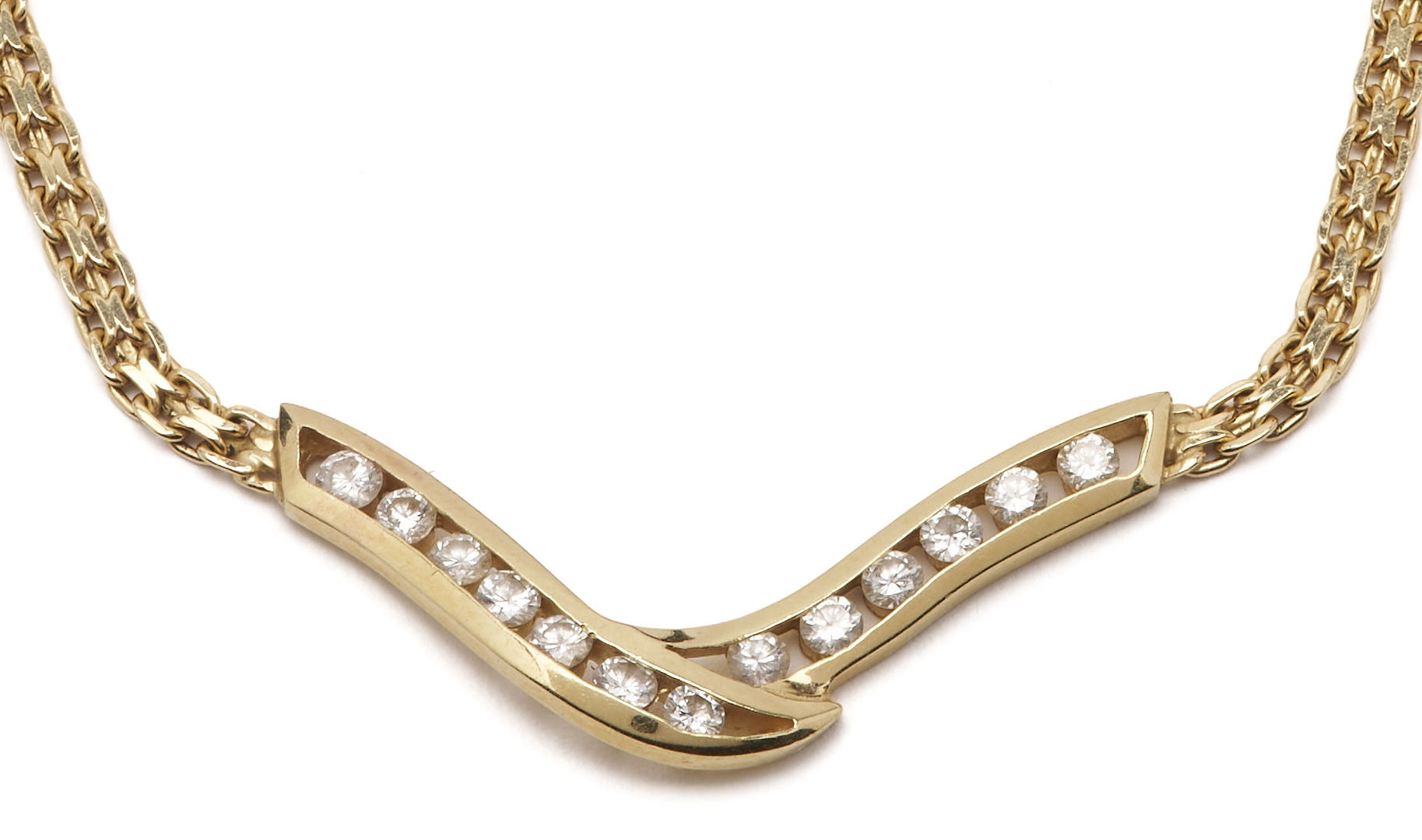 Lot 803: 14K Channel Set Diamond V Necklace