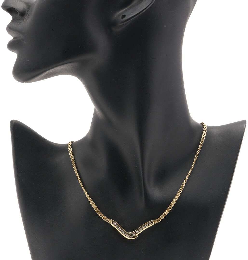 Lot 803: 14K Channel Set Diamond V Necklace
