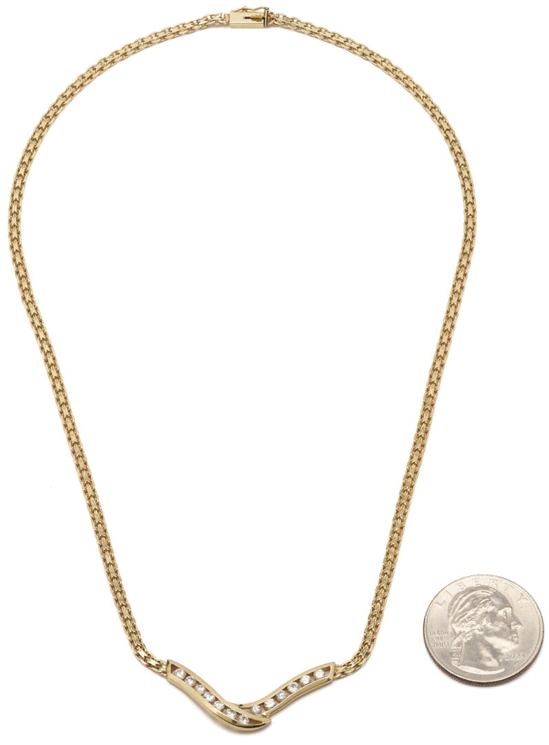 Lot 803: 14K Channel Set Diamond V Necklace