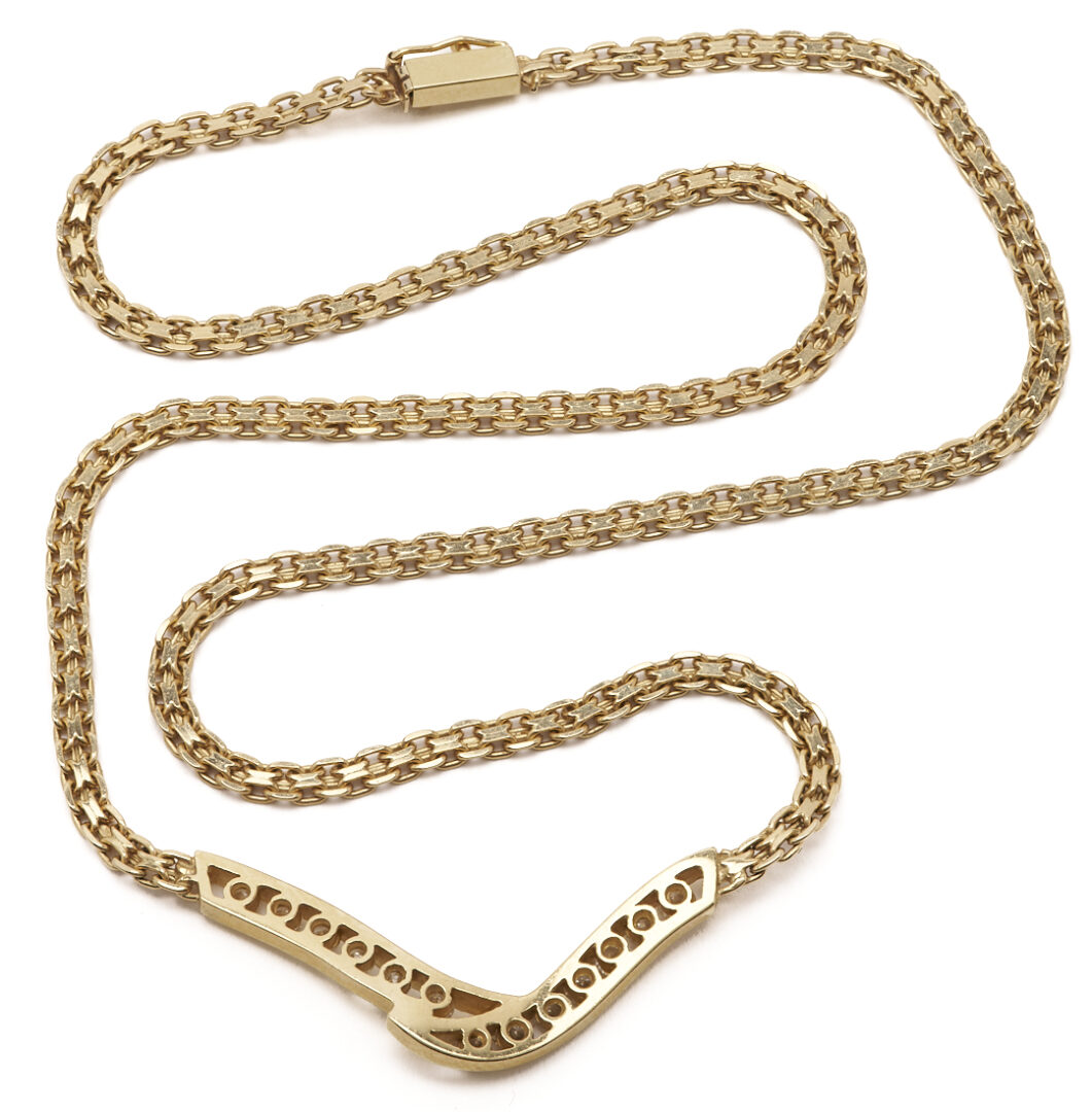 Lot 803: 14K Channel Set Diamond V Necklace