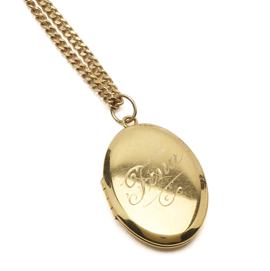 Lot 974: 14K Engraved Locket Necklace