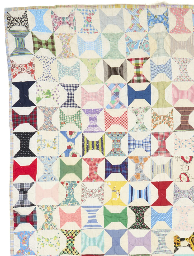 Lot 1060: Two American Pieced Quilts,  Rolling Stone & Spools Patterns