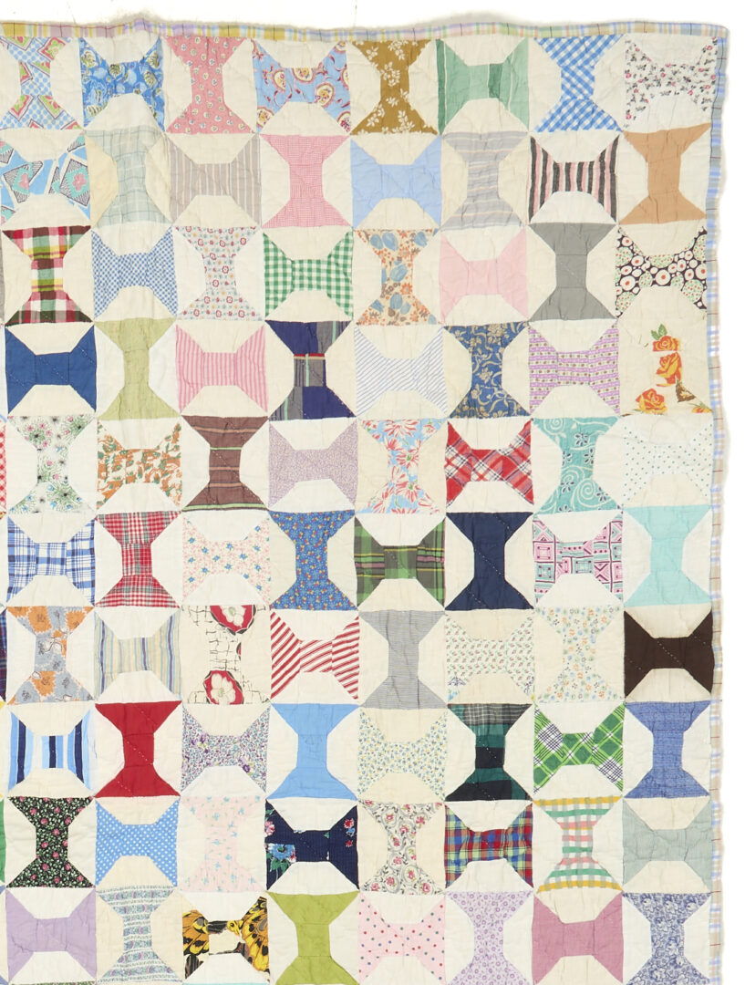 Lot 1060: Two American Pieced Quilts,  Rolling Stone & Spools Patterns