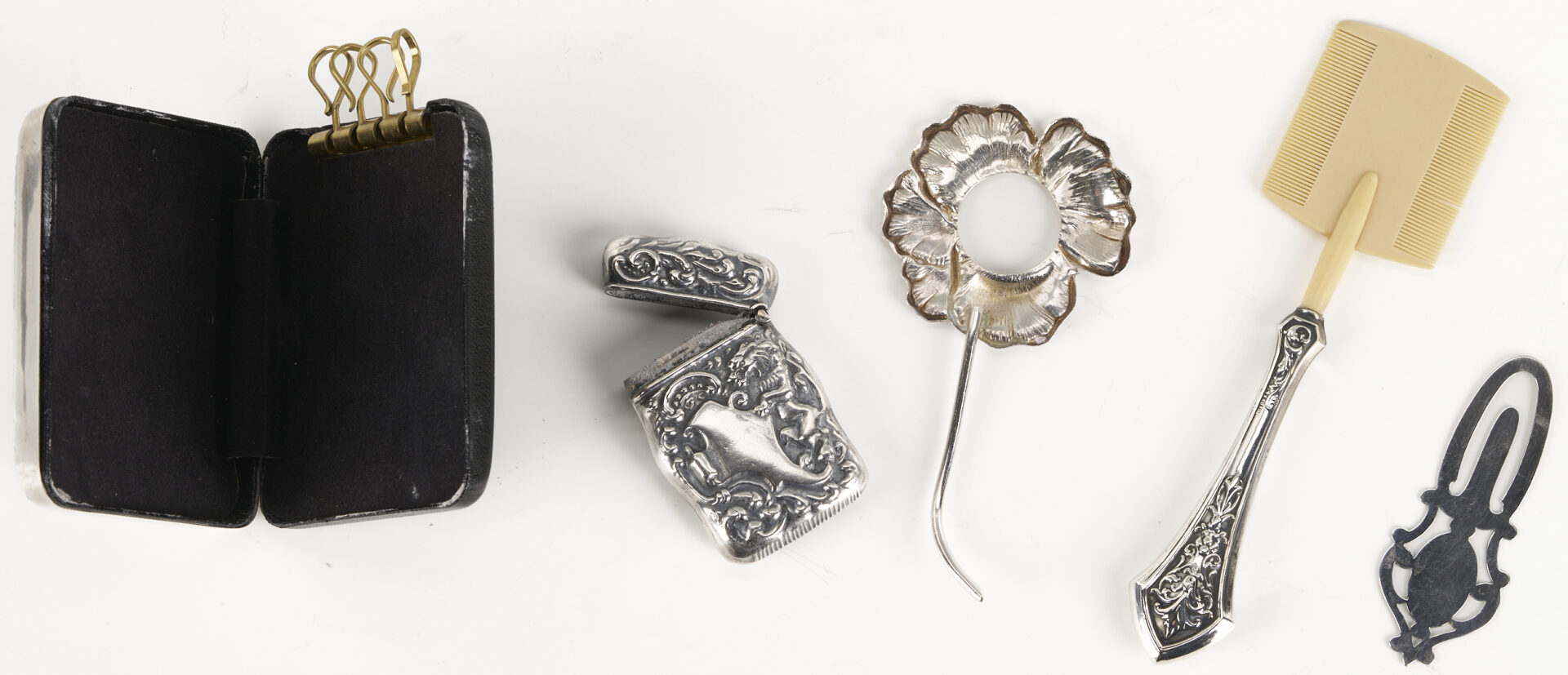 Lot 1298: 25 silver Novelty Items including Baby Silver