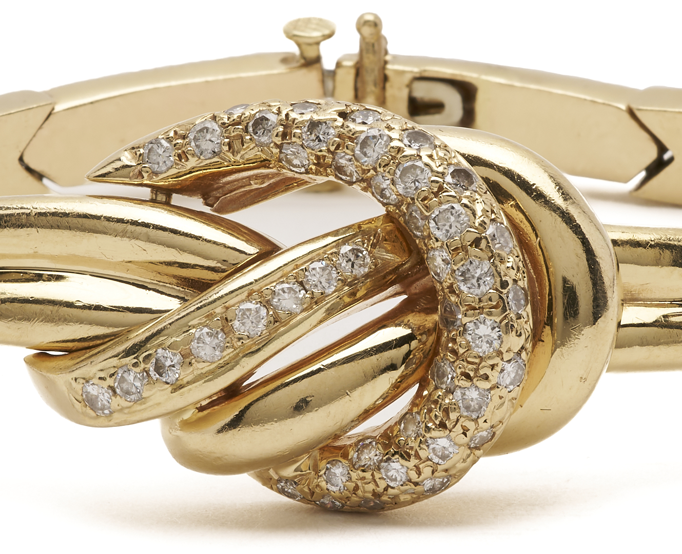 Lot 321: 14K Gold & Diamond Knot Bracelet