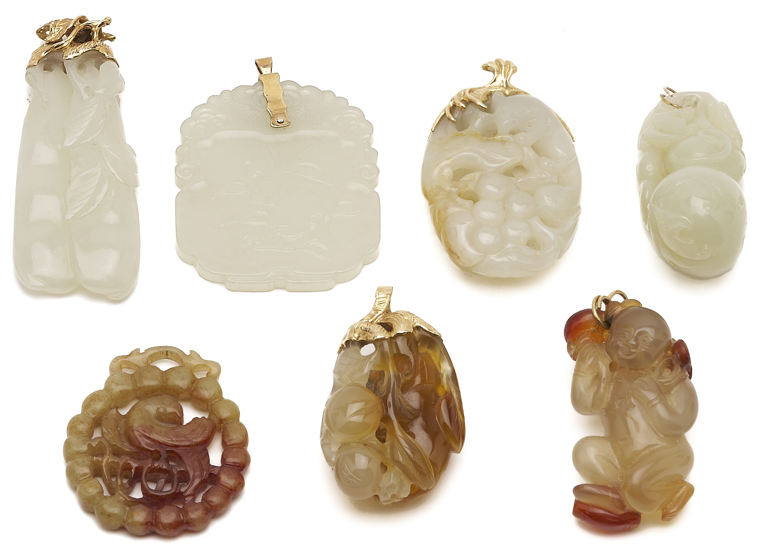 Lot 36: 7 Gold & Carved Nephrite Jade Pendants