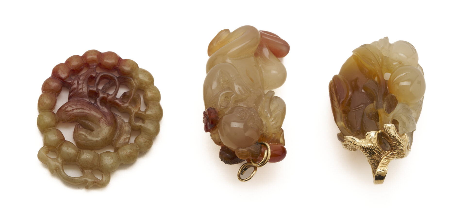 Lot 36: 7 Gold & Carved Nephrite Jade Pendants
