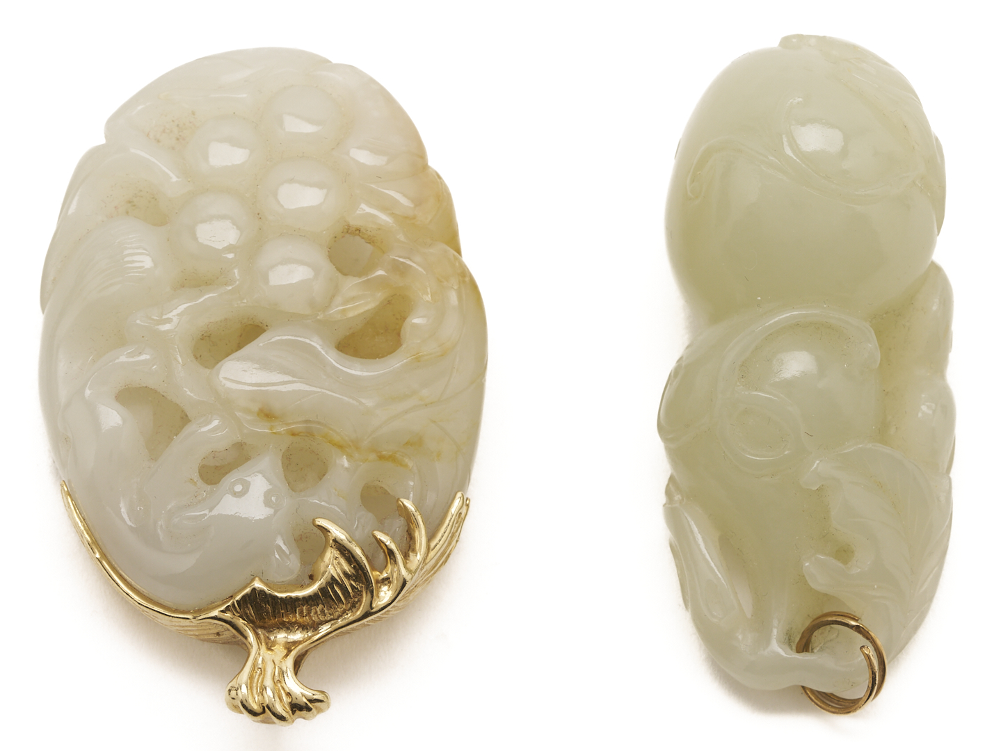 Lot 36: 7 Gold & Carved Nephrite Jade Pendants