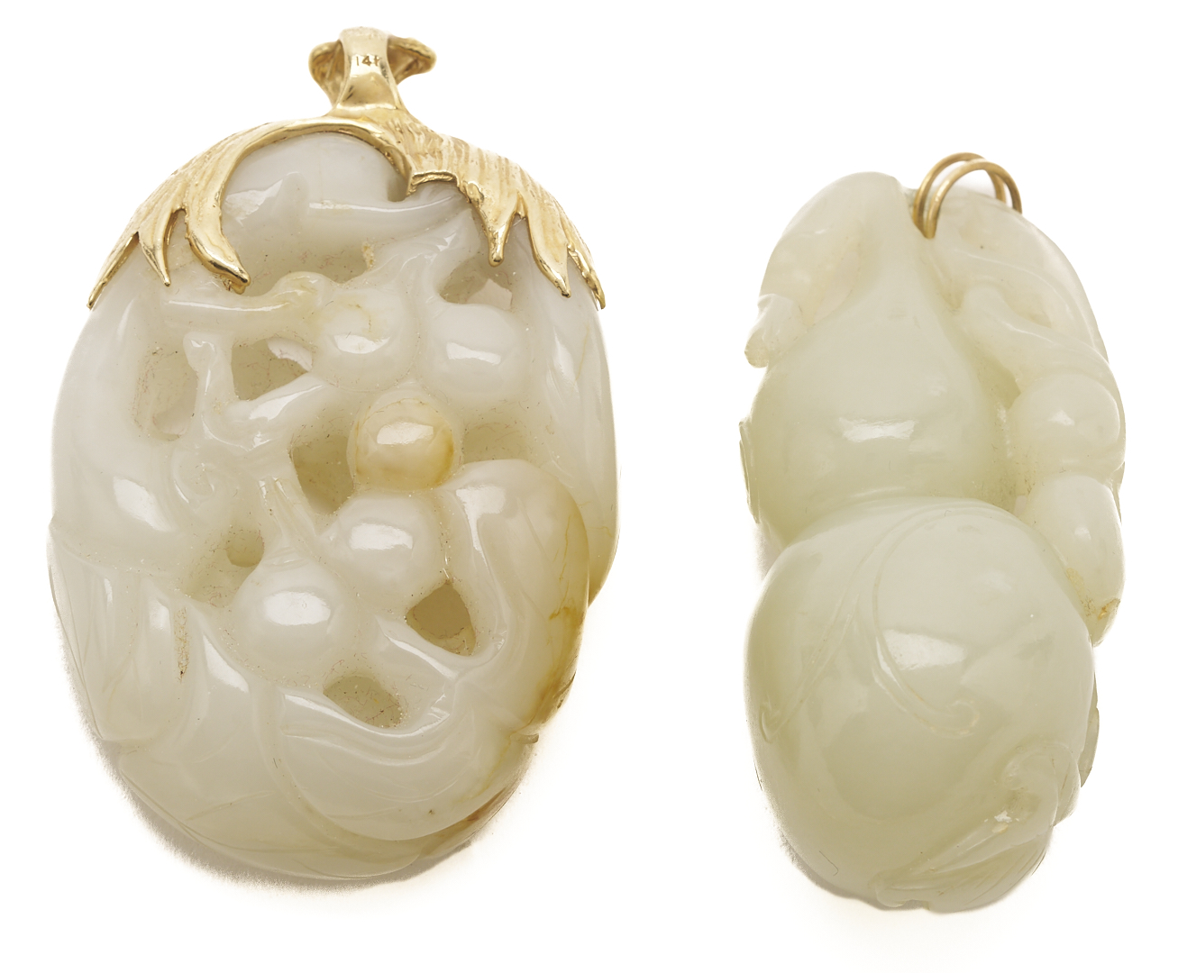 Lot 36: 7 Gold & Carved Nephrite Jade Pendants